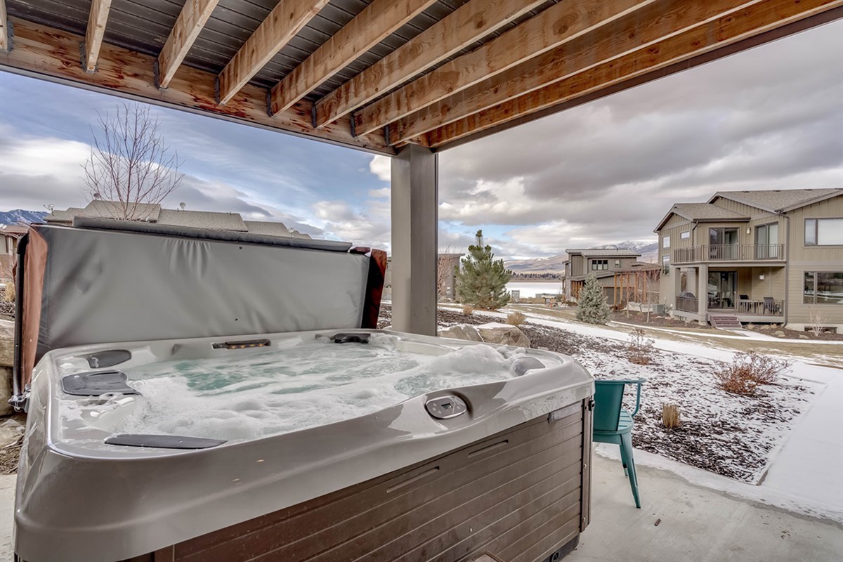 Unwind in your private covered hot tub after a day of adventure