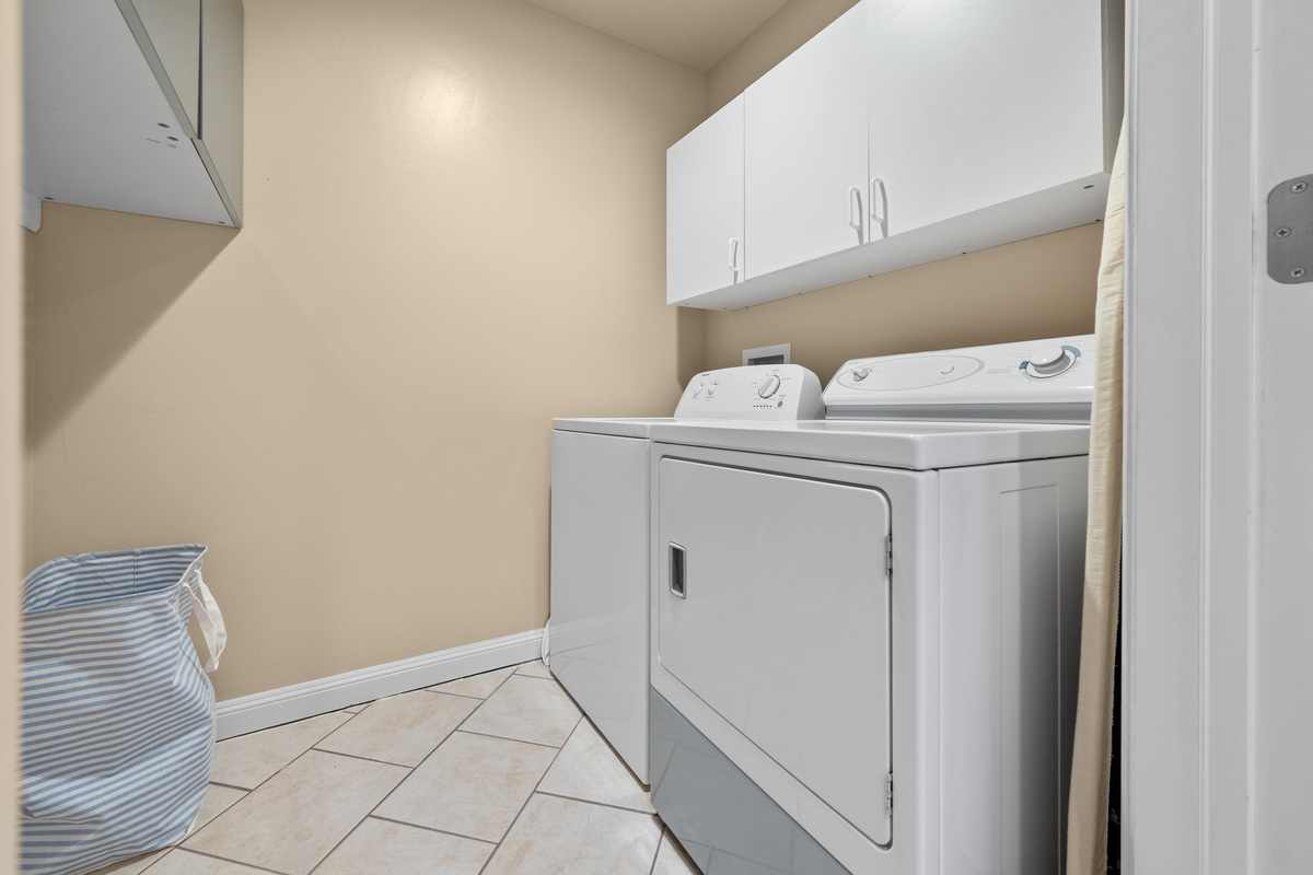 Full laundry room with washer and dryer, making it easy to refresh clothes and gear during longer stays and outdoor adventures.