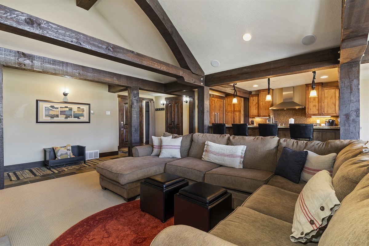 Plush sectional seating invites you to unwind in a warm, lodge-inspired setting—ideal for entertaining or enjoying quiet evenings by the fire.