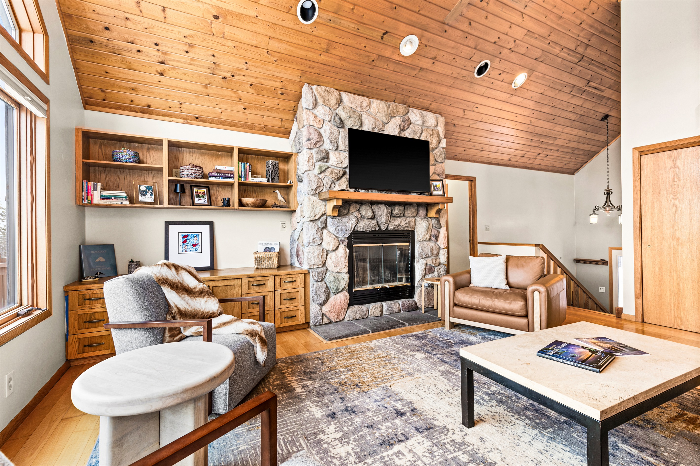 The open-concept design seamlessly connects the living area to the kitchen and dining room, making it perfect for family moments and entertaining after a day of North Shore adventures.