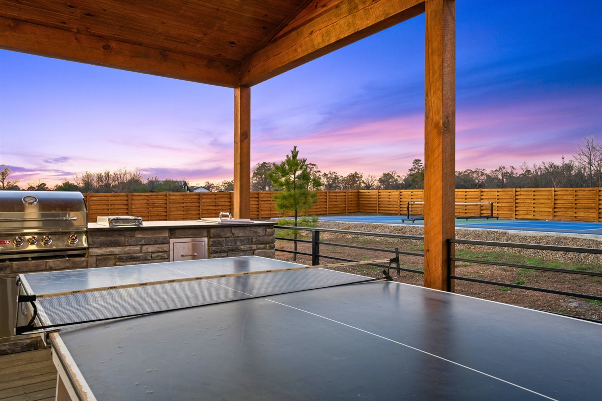 The covered deck keeps everything shaded, making it a great place to cook, eat, and relax no matter the weather.
