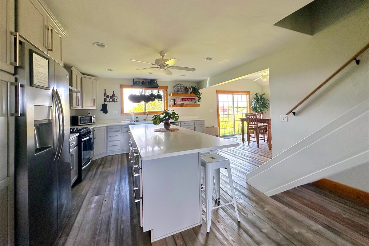 With tons of counter space and an island, this is a lovely conversation and workspace.