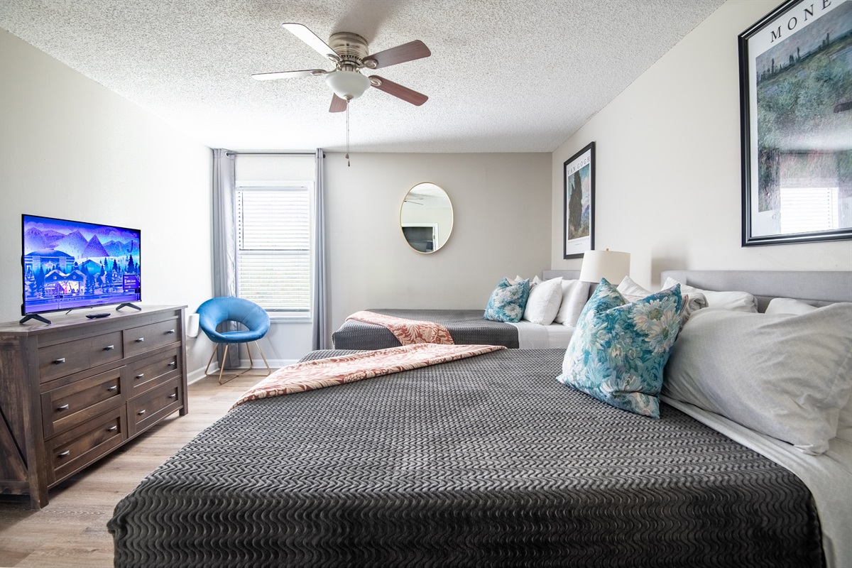 The guest room in Unit A has two cozy queen beds, a smart TV to stream all your favorites, and has been intentionally designed for rest and relaxation.
