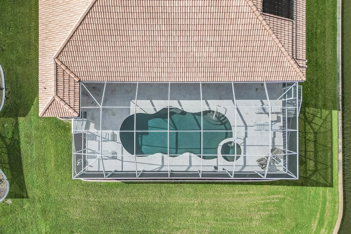 Aerial view showcasing the pool area and its stunning surroundings from above!