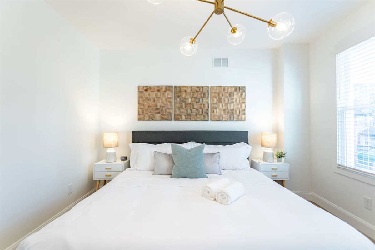 View of the spacious king-size bed, offering ultimate comfort and relaxation.