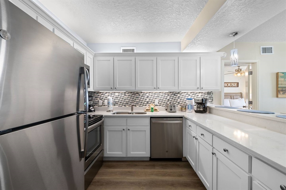 Stainless steel appliances and updated cabinets, stocked with just about everything you could possibly need.
