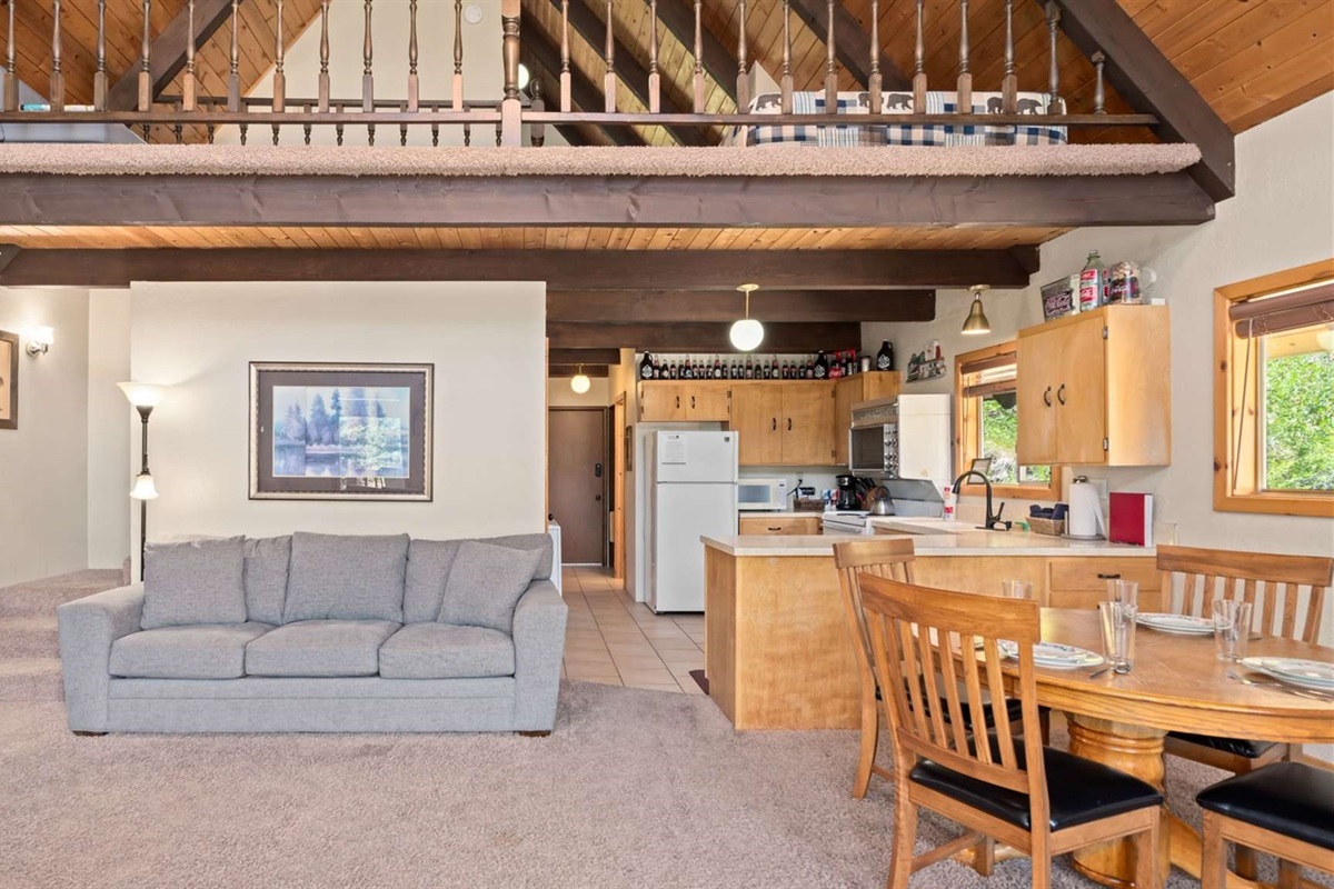 Warm cabin interiors with vaulted ceilings and cozy mountain charm.