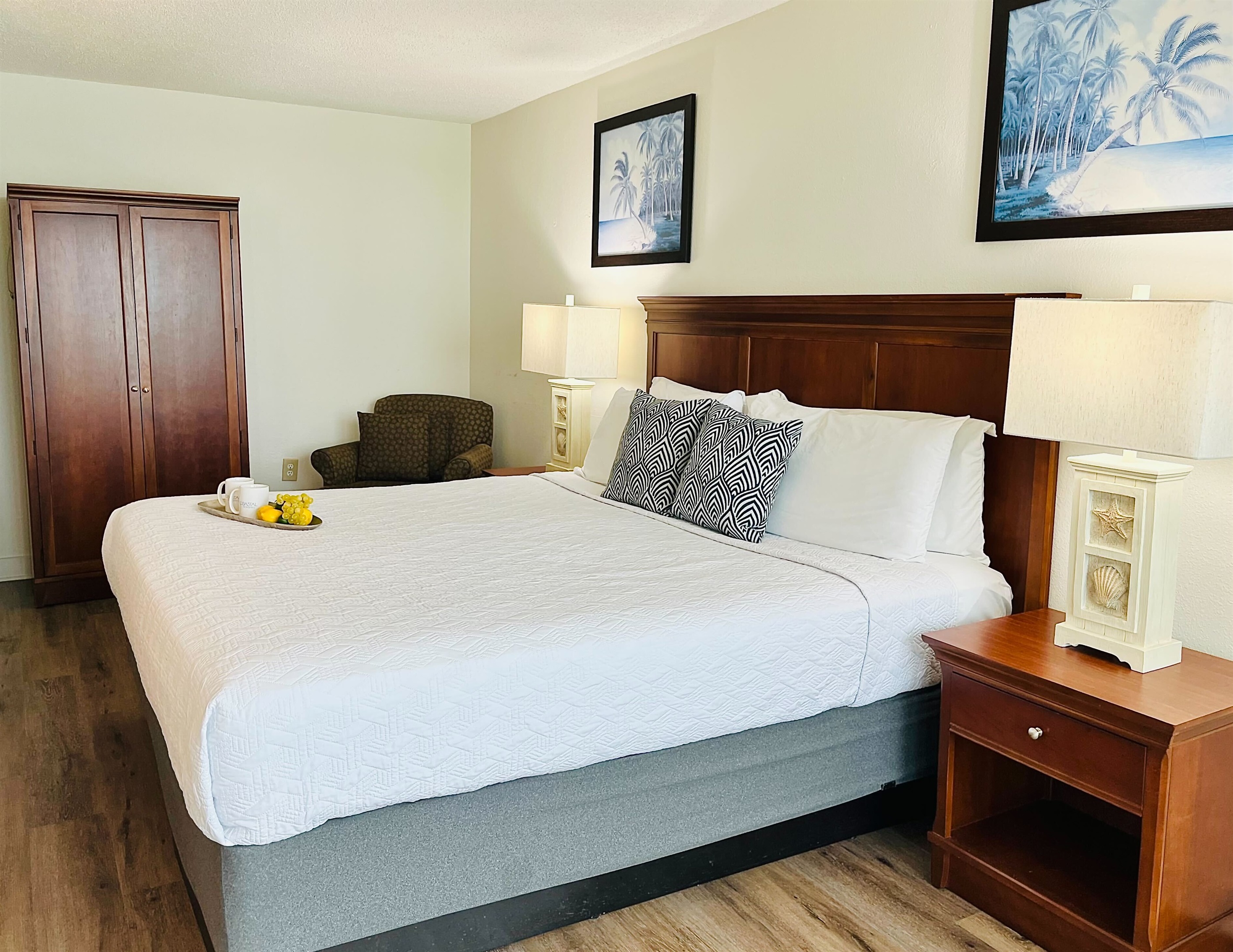 Drift into tranquility on a bed near the balcony of our oceanfront suite, where the gentle ocean breeze and stunning vistas create a peaceful haven.