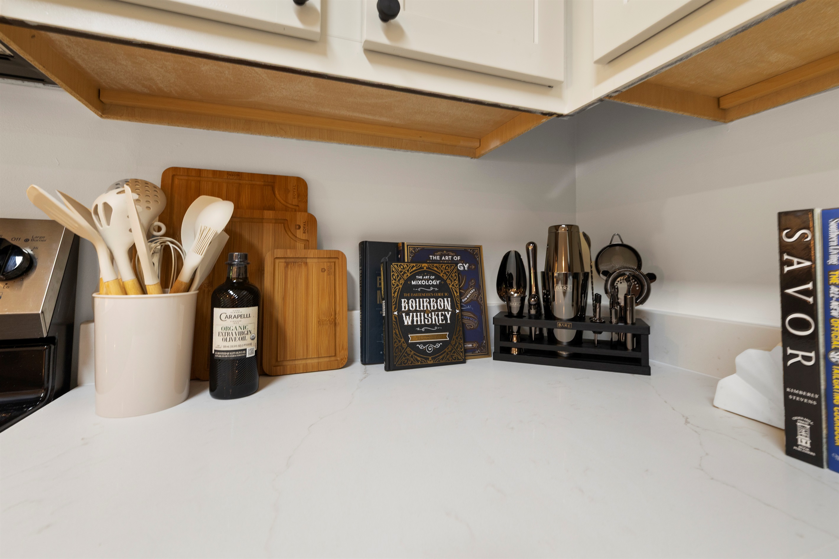 From cocktails to home-cooked meals, the kitchen is stocked with bar tools, cookbooks, and all essentials.