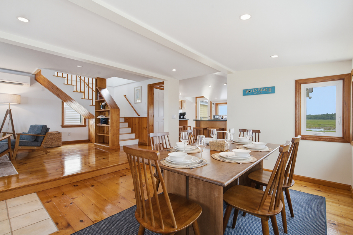 Open-concept main living area with seamless flow between the kitchen, dining, and living spaces.