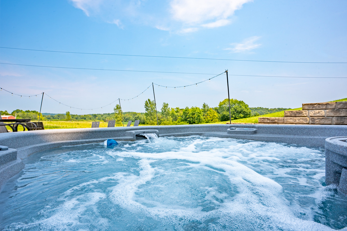 Soak, relax, and take in the peaceful countryside surroundings from your private outdoor hot tub - perfect after a day of exploring.