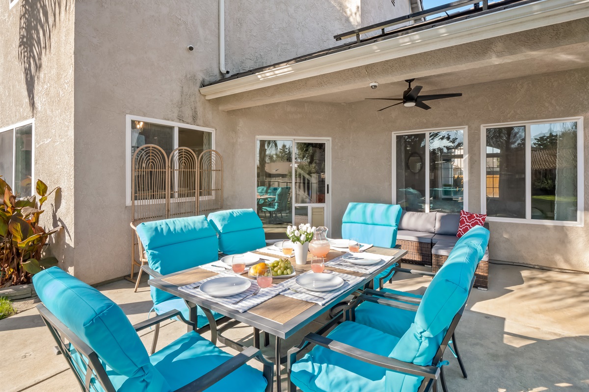 Large outdoor dining table with comfortable cushioned seating—perfect for family breakfasts, backyard BBQ dinners, and evening game nights.