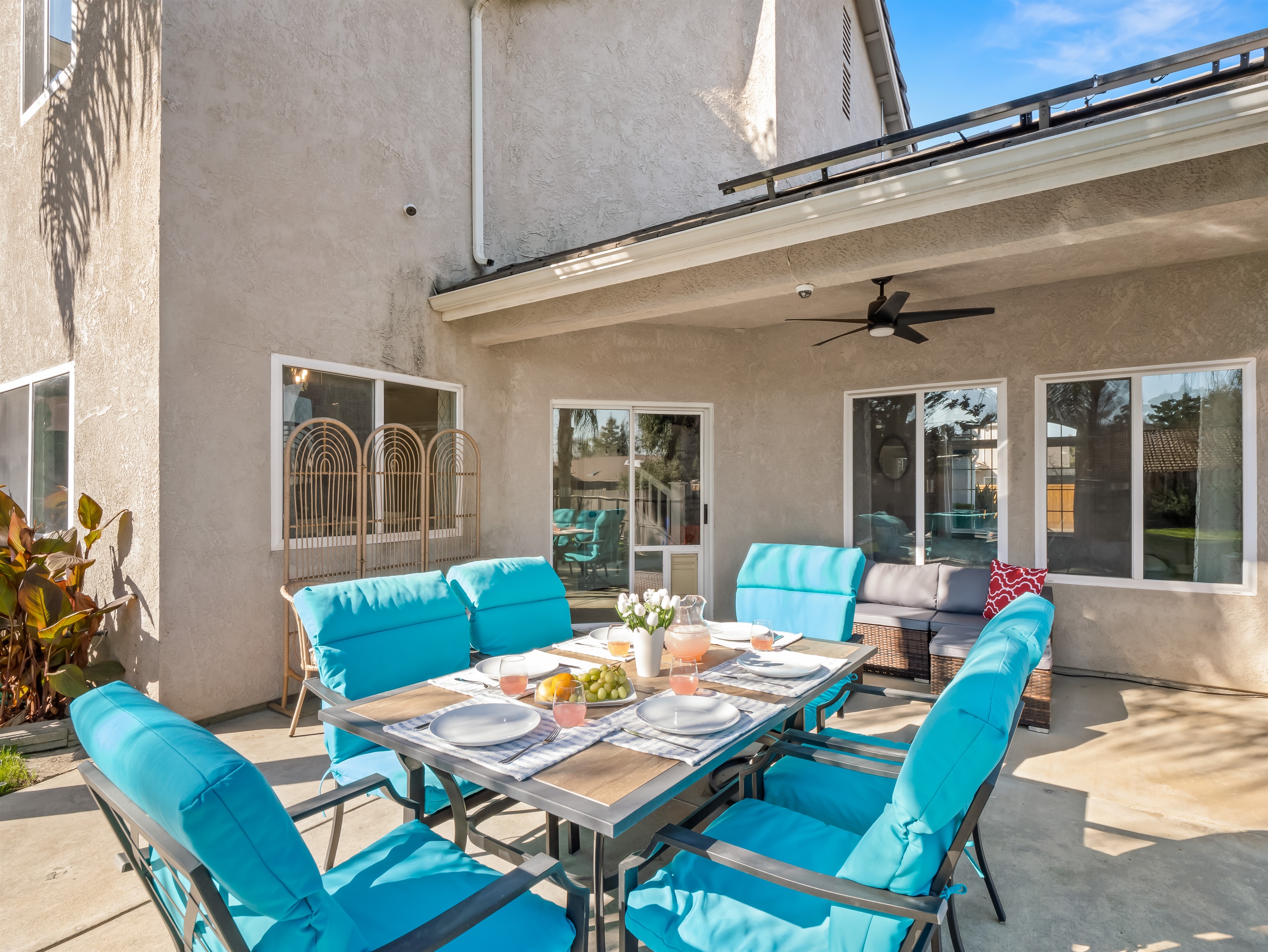 Large outdoor dining table with comfortable cushioned seating—perfect for family breakfasts, backyard BBQ dinners, and evening game nights.