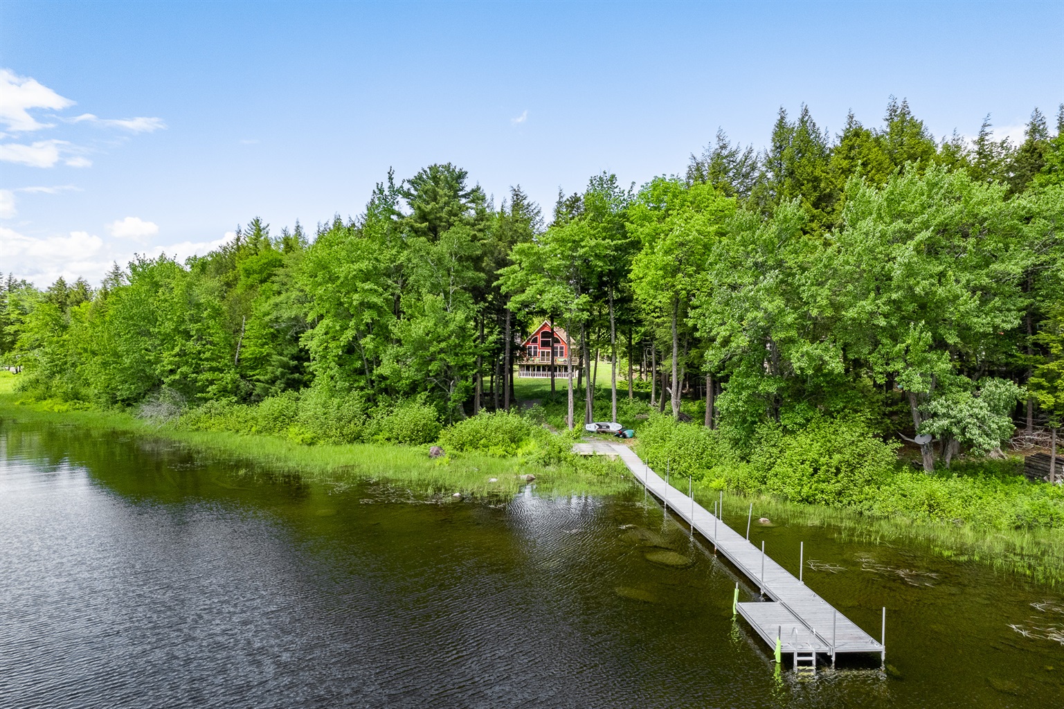 Private dock on Sebec Lake that's perfect for kids to do some fishing, tie up a boat, swim to the floating island in front of the dock. 2 kayaks and 2 paddle boards provided as well.