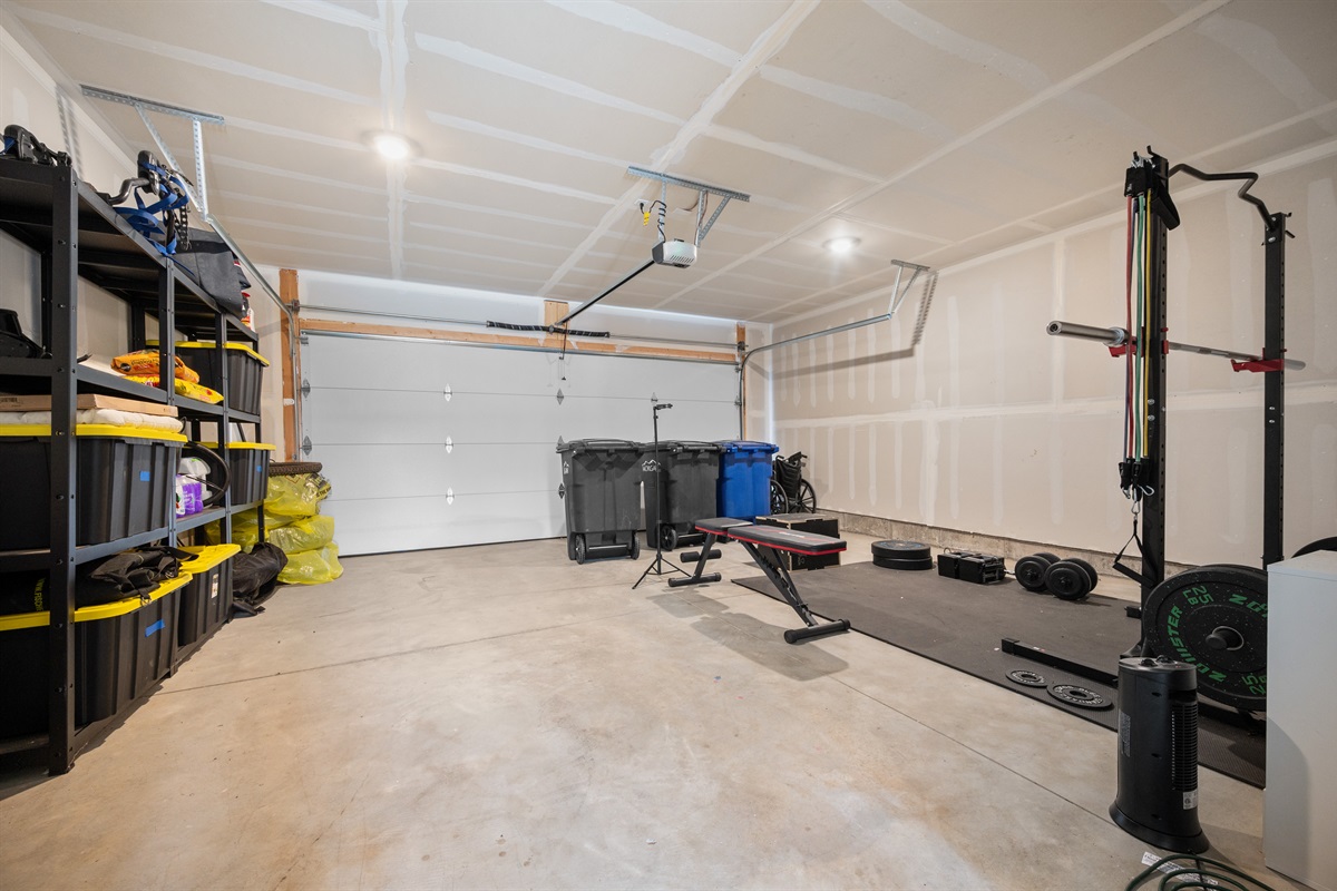 Large garage with space for working out and gear storage.