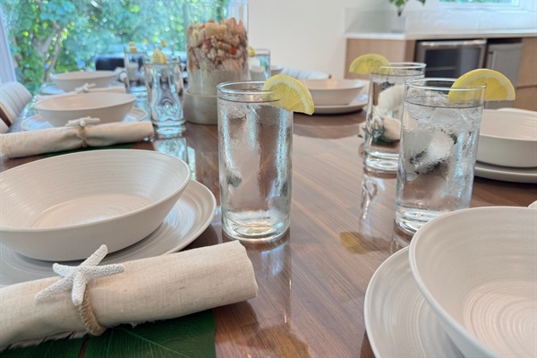 Gather around the table and enjoy the views of the swaying palms and lush greenery