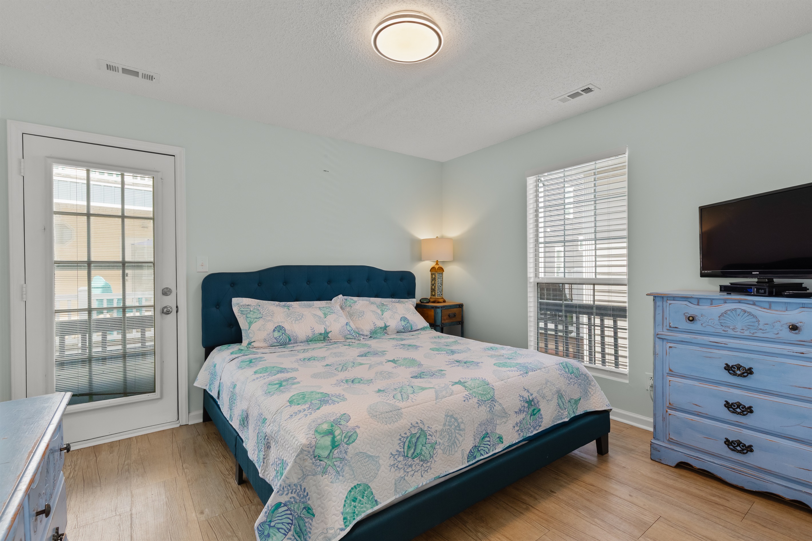 Primary Bedroom with King bed, ensuite bathroom and Smart TV
