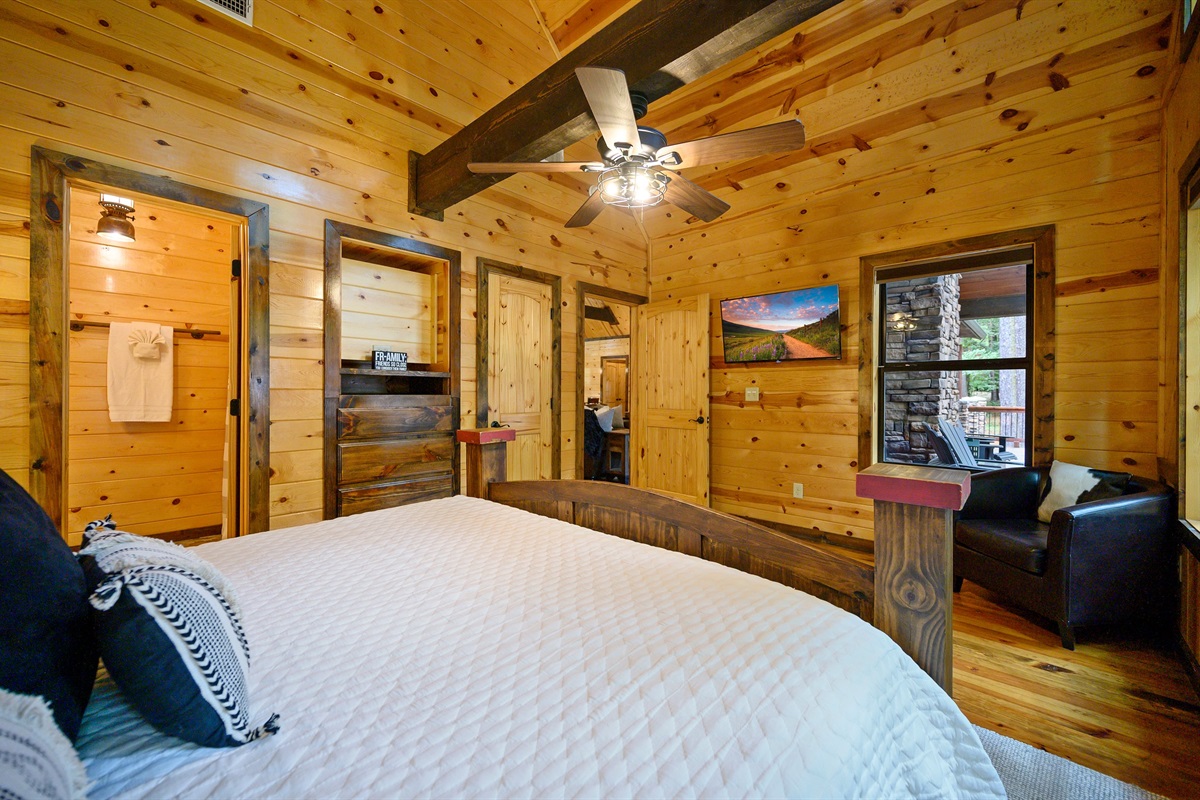 Roku TV in all bedrooms. Reading chair in room and roller shades on lower windows for privacy.