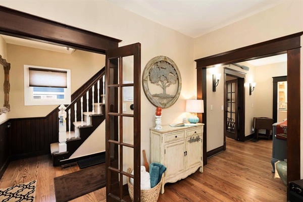 From the living room, you'll find:
* Stairs up the the bedrooms & bathroom
* A hallway leading to the den, bathroom & kitchen