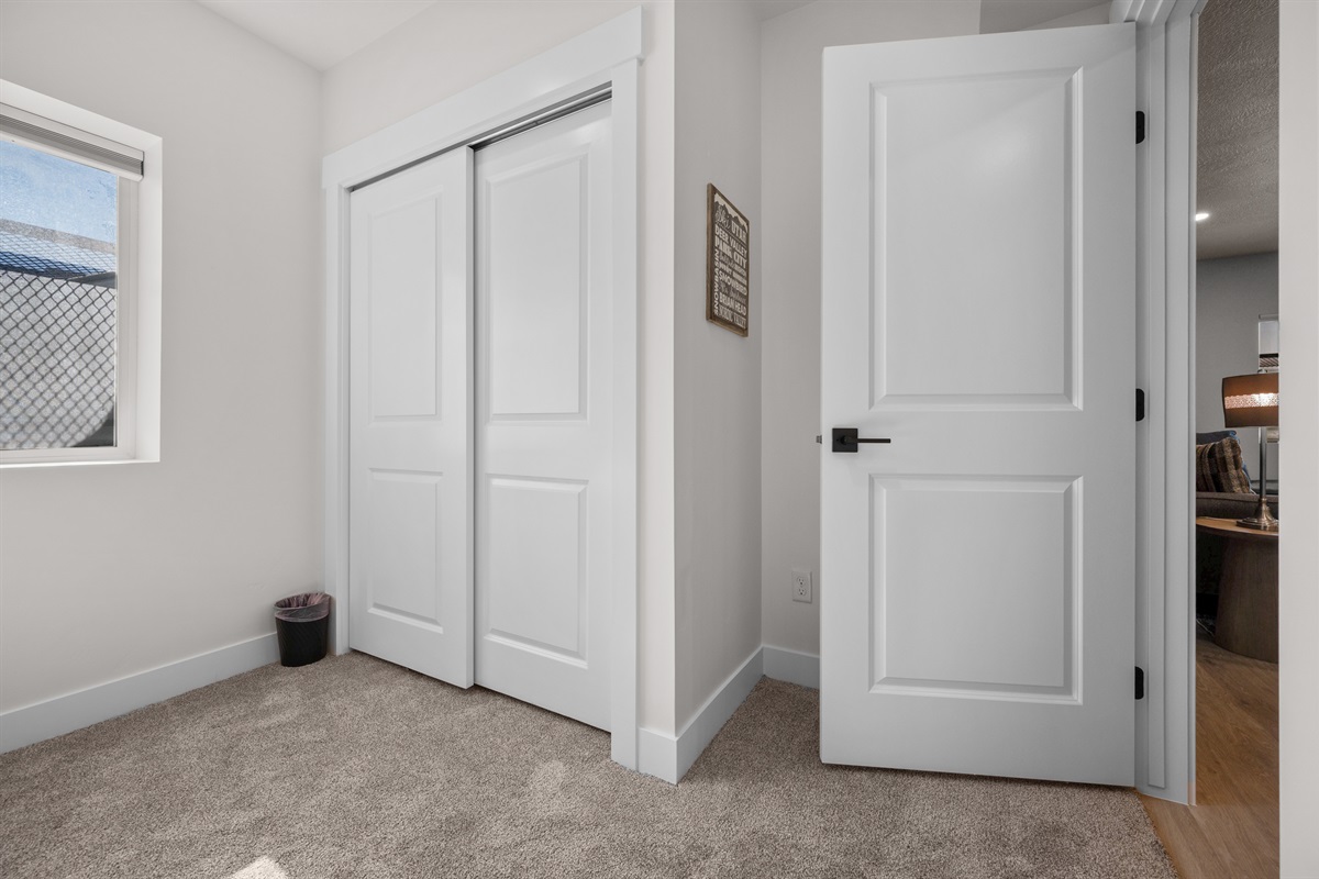 Spacious bedroom with double closet and natural light.