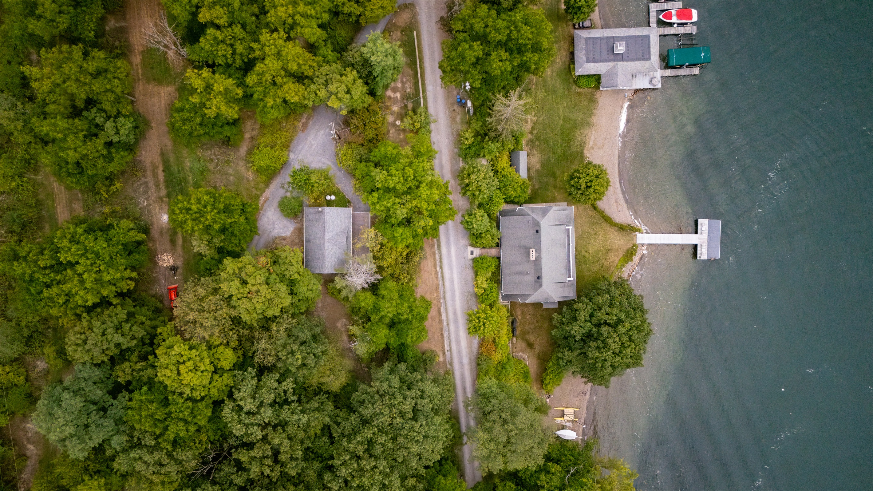 Bird’s-eye view of the property. Please note the bigger house with the dock is not part of this property
