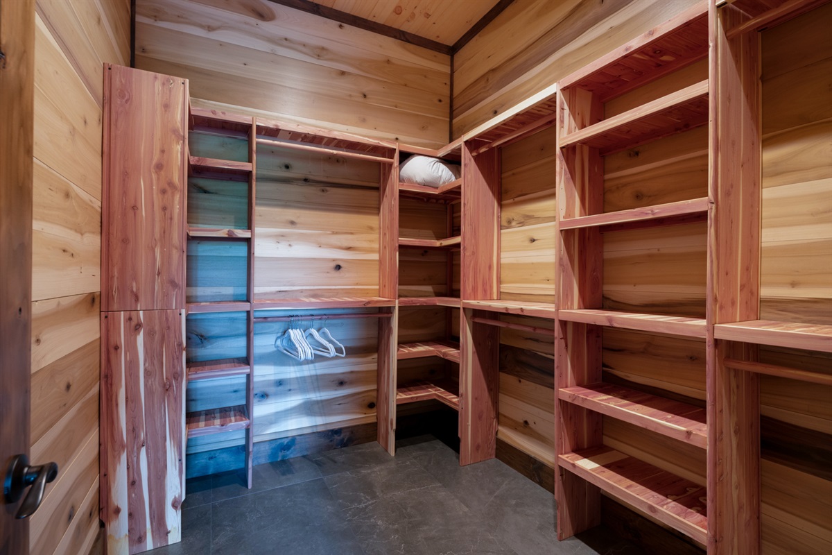 Constructed with gorgeous Cedar wood - this master closet offers ample storage space to keep your belongings organized and out of the way.