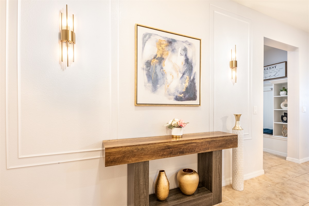 Entrance hall with stunning light fixtures and artwork