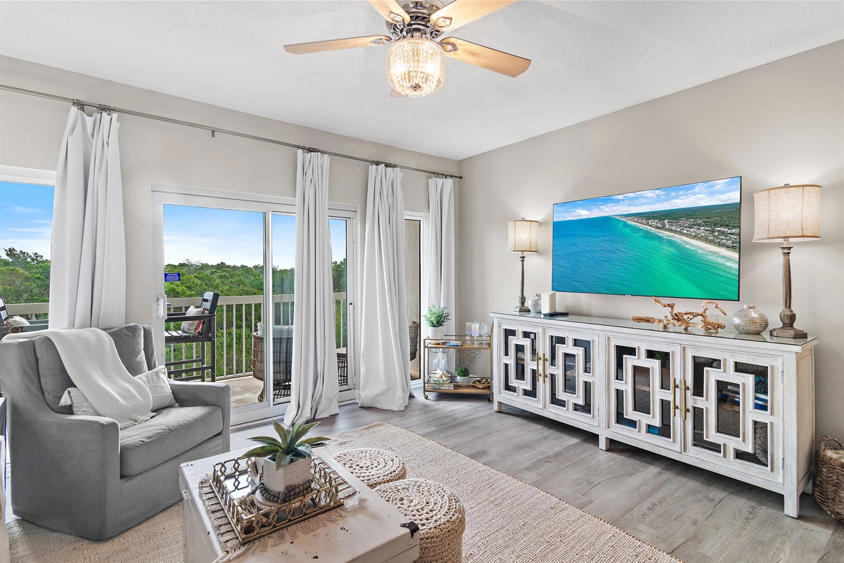 Tops'l Summit 405 has comfortable living room furniture (including a queen sleeper sofa), 65" Smart TV, Views of Tops'l State Park and Partial Views of the Gulf of Mexico