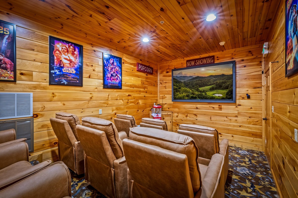 The theater room has the most comfortable recliner chairs and an 85" Smart TV