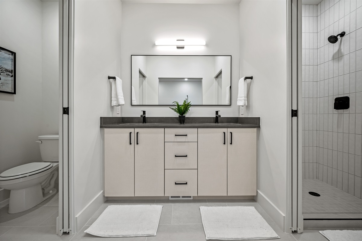 Dual sinks, sleek countertops, and a spacious mirror — perfect for getting ready in style.
