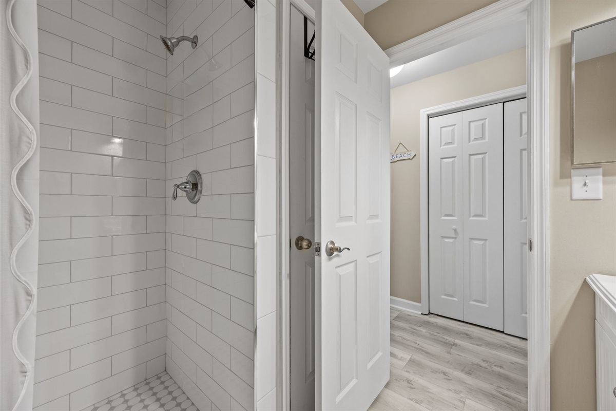 Walk-in shower with modern fixtures and stocked essentials in Master bathroom 2