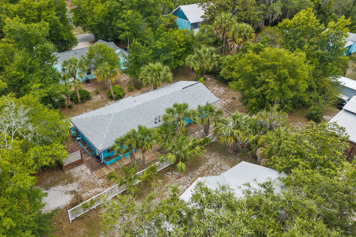 Aerial view of the property and surrounding neighborhood
