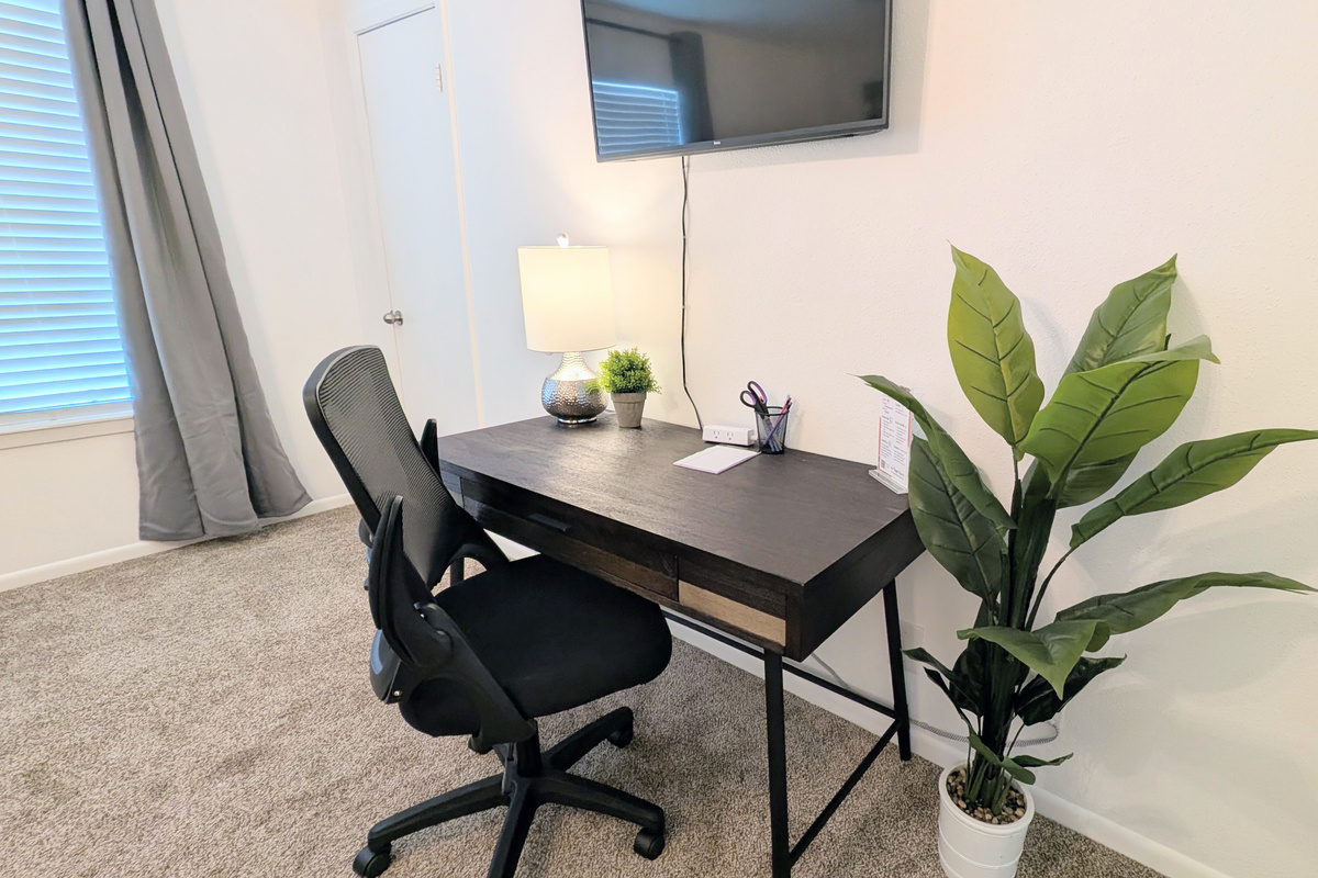 The queen bedroom also includes a dedicated workspace that can double as an additional vanity space.
