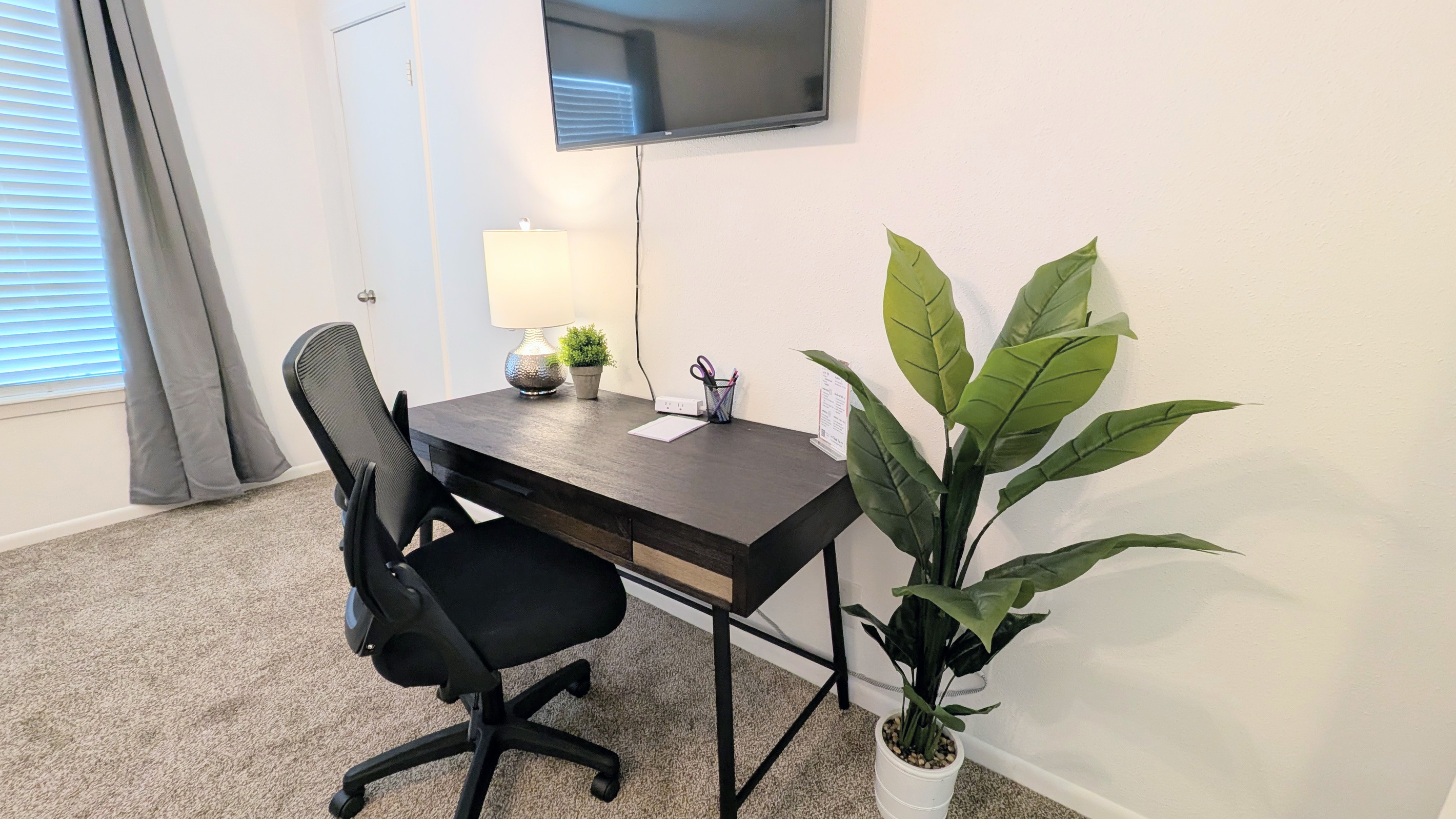 The queen bedroom also includes a dedicated workspace that can double as an additional vanity space.