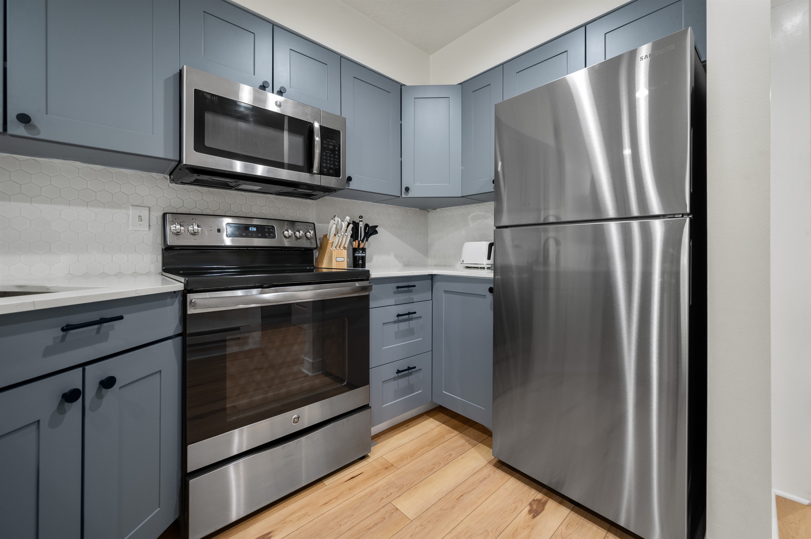 Cook with ease in a kitchen featuring every appliance needed for gourmet meals.