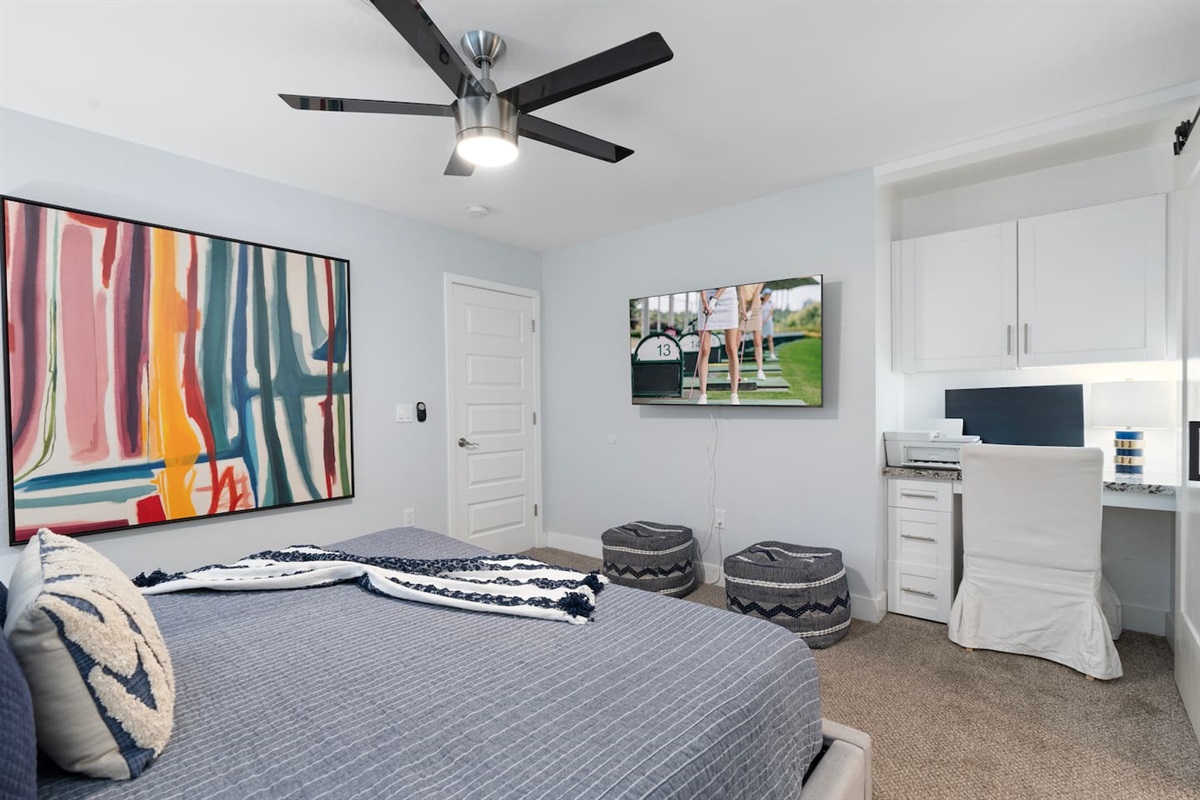 Inviting view from the bed, complete with a TV for a perfect combination of comfort and entertainment.