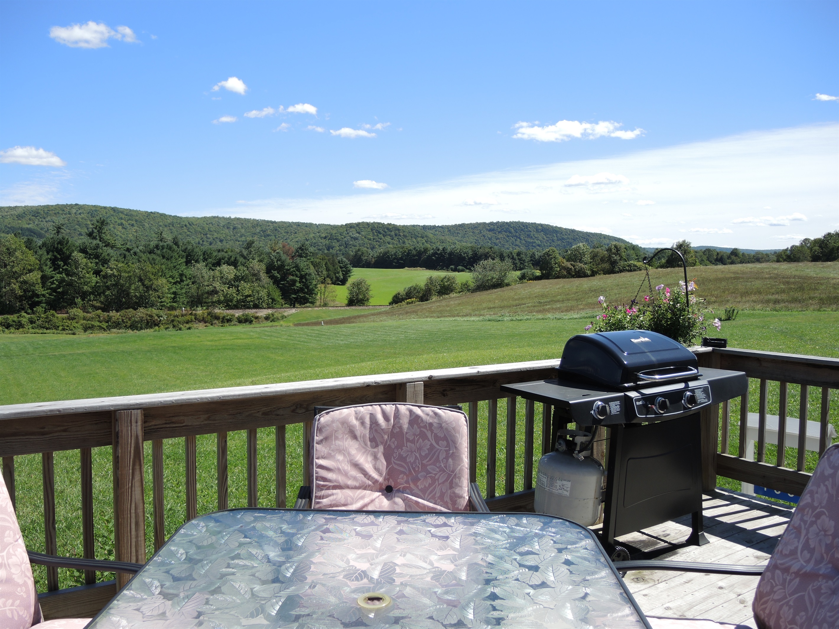 View of acres of lawn and hills beyond