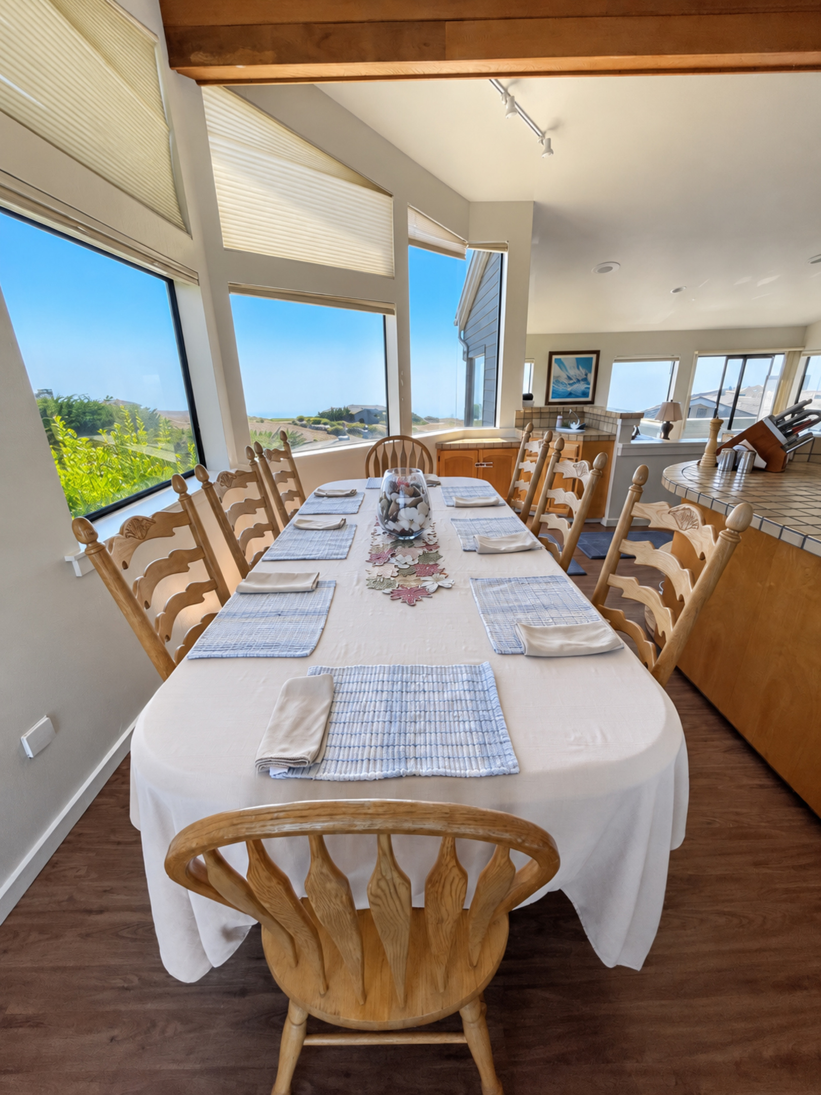 Dining table with Ocean and Fairway views seats 8-10. Extra chairs in guest bdrms