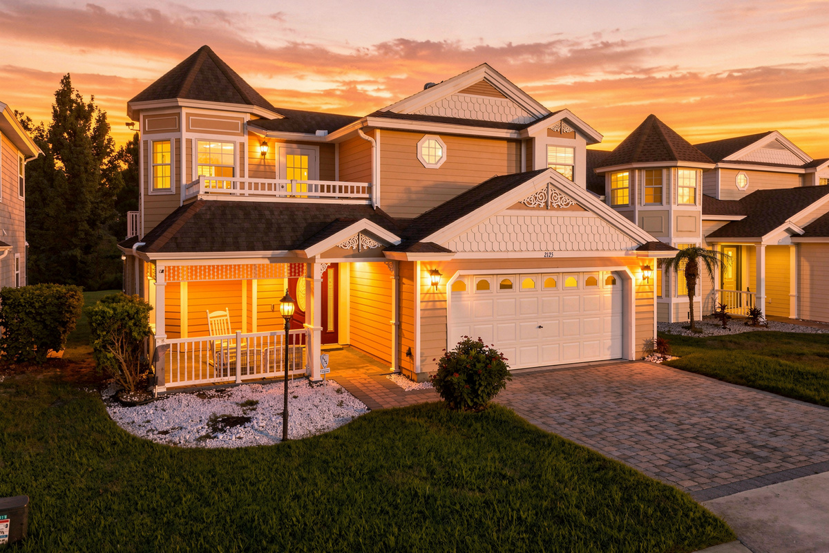 Front of house, Disney style, balcony up top, porch below