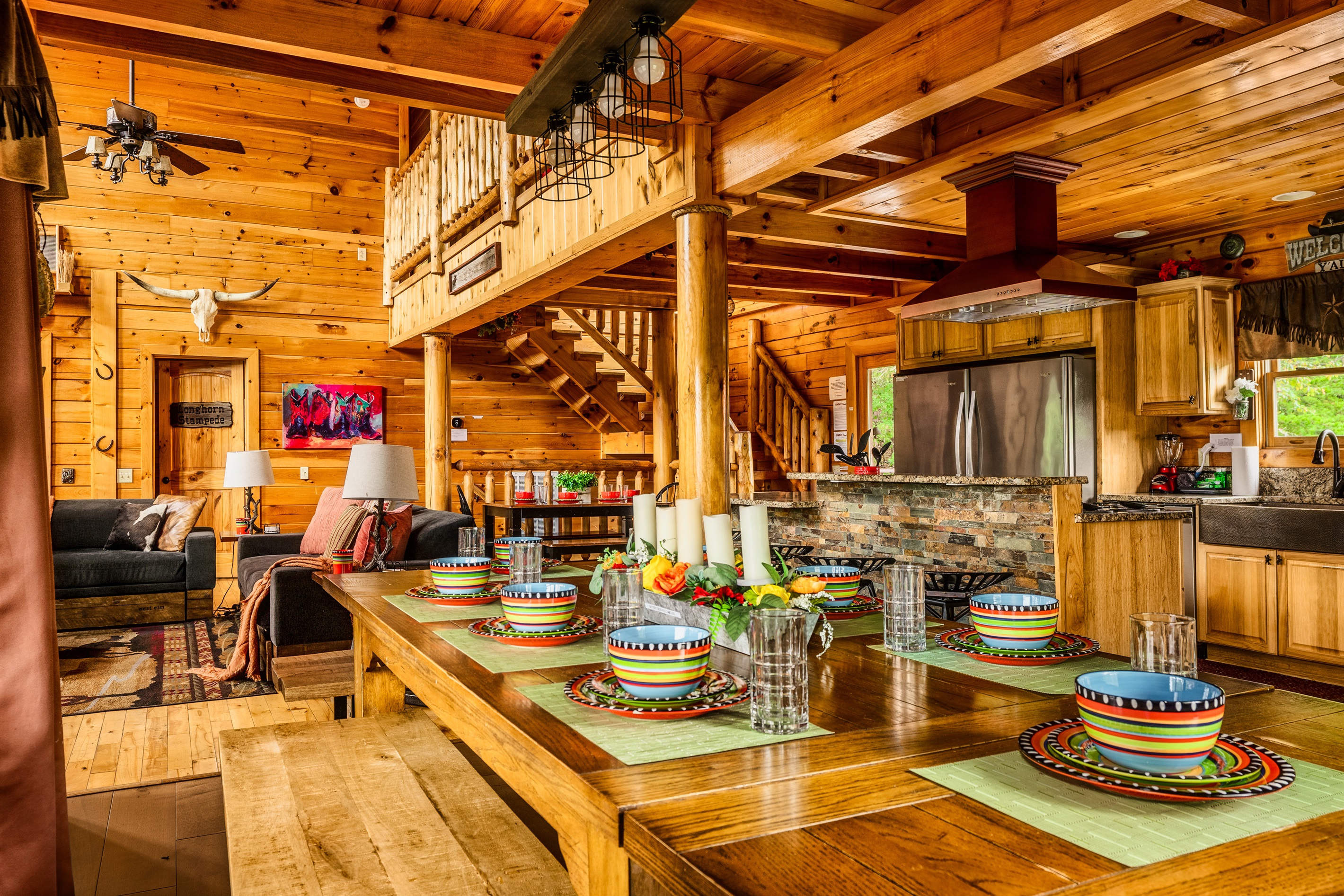 Dining table, great room and kitchen combined for family gatherings.