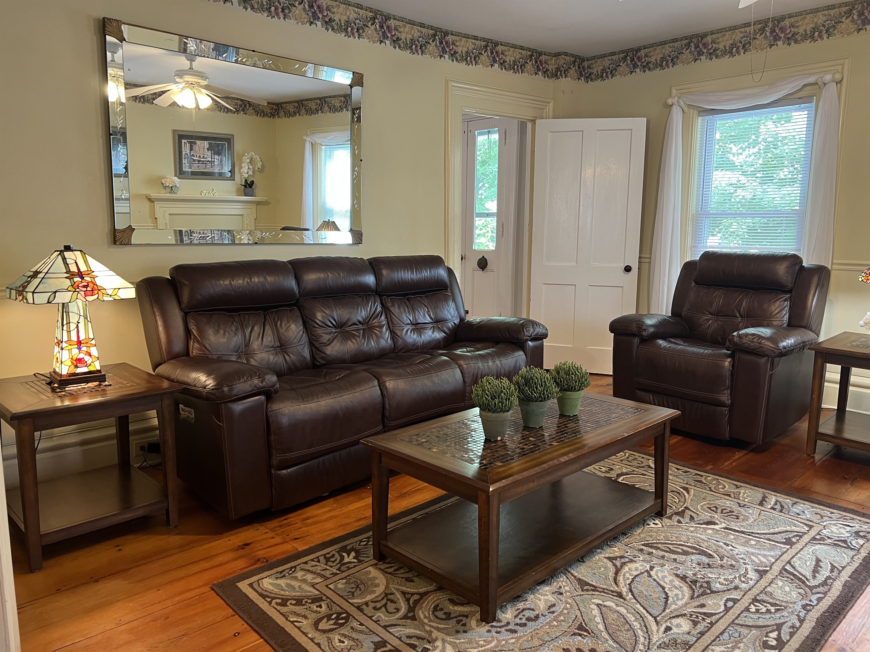 The Federal House Living Room with electric recliners .