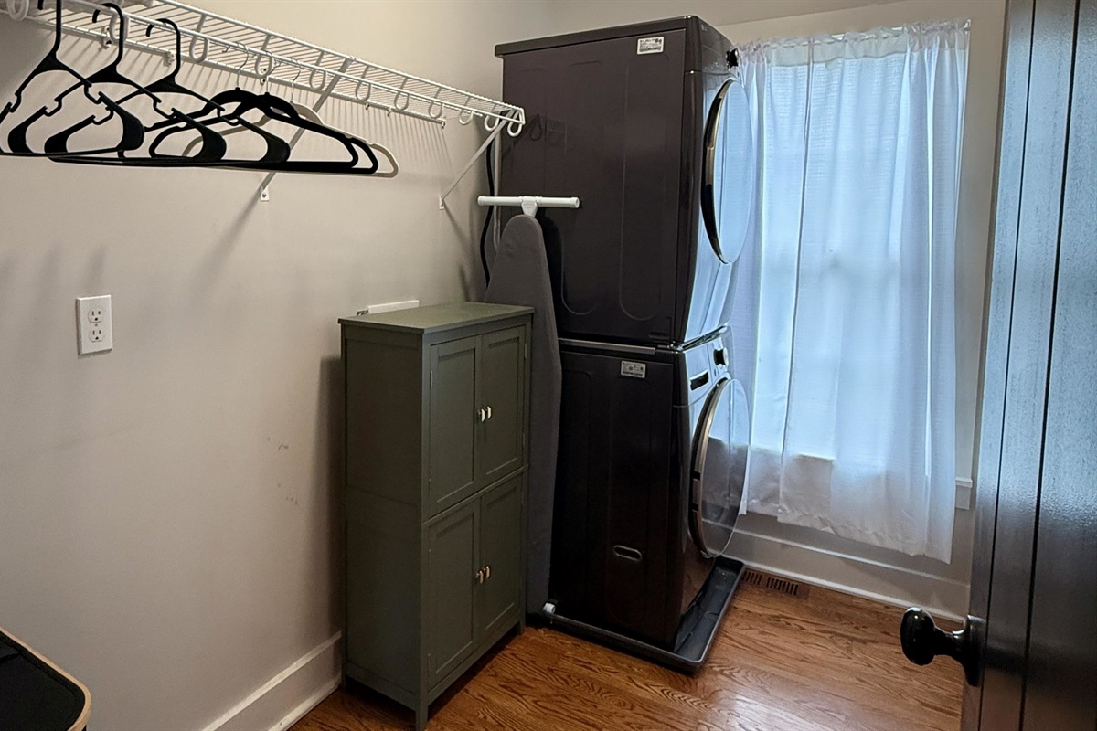 A modern luxury touch — the washer and dryer discreetly built into the primary suite’s closet blend form and function, offering effortless convenience within your private retreat.