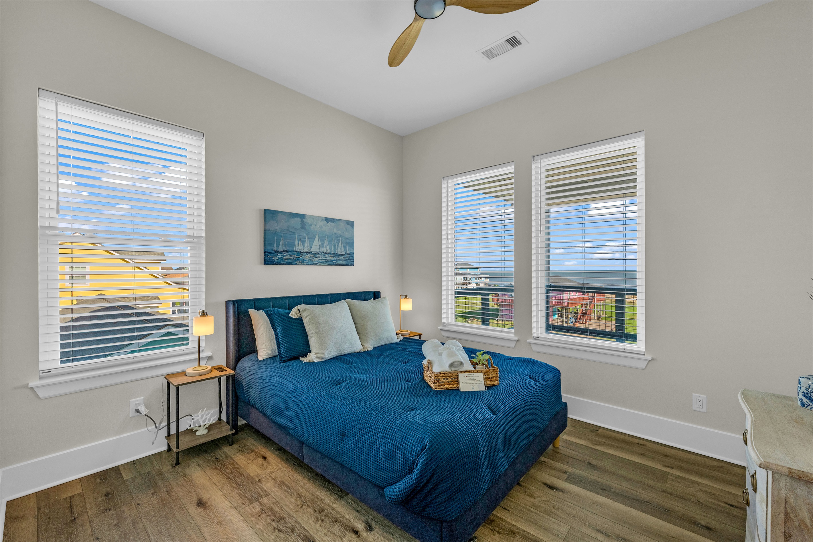 Costa Cristal Bedroom 3: Relax in a luxurious queen bedroom flooded with natural light. Floor-to-ceiling windows offer breathtaking ocean views, creating a serene and inviting retreat.