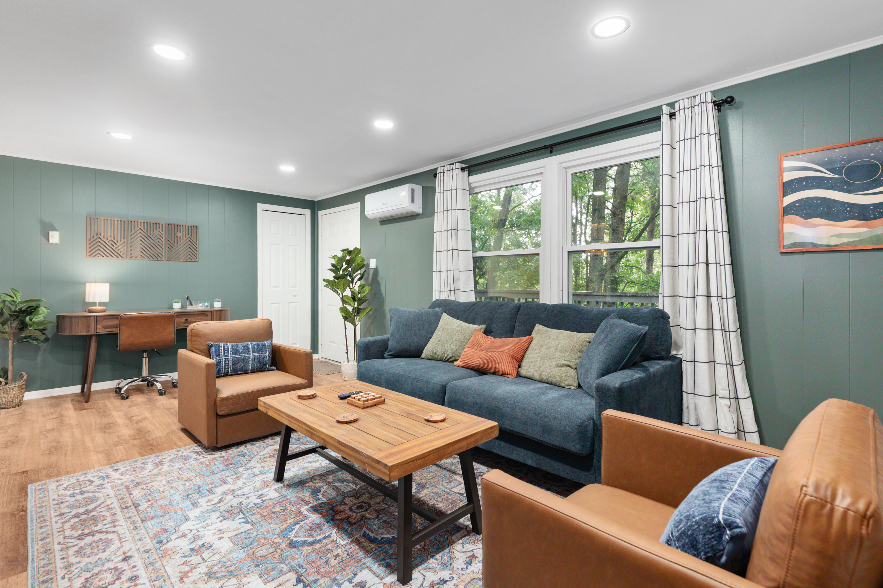 Sink into the sofa and let the day melt away — after a hike through Cacapon State Park or a day exploring downtown Berkeley Springs, this cozy living room with its stone fireplace and soft textures is the perfect spot to unwind during your getaway.