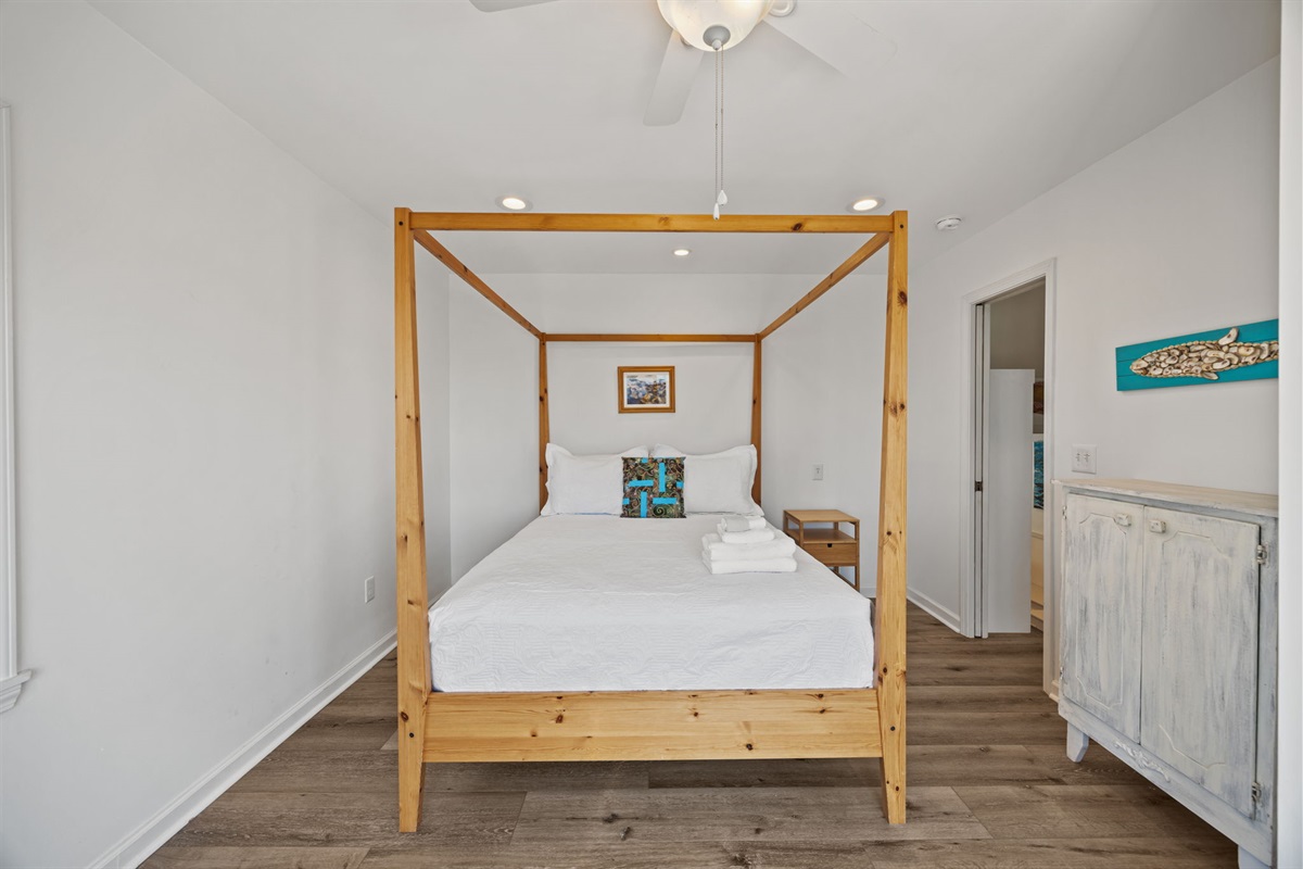 Spacious layout with a ceiling fan, TV, and easy access to the upstairs bath