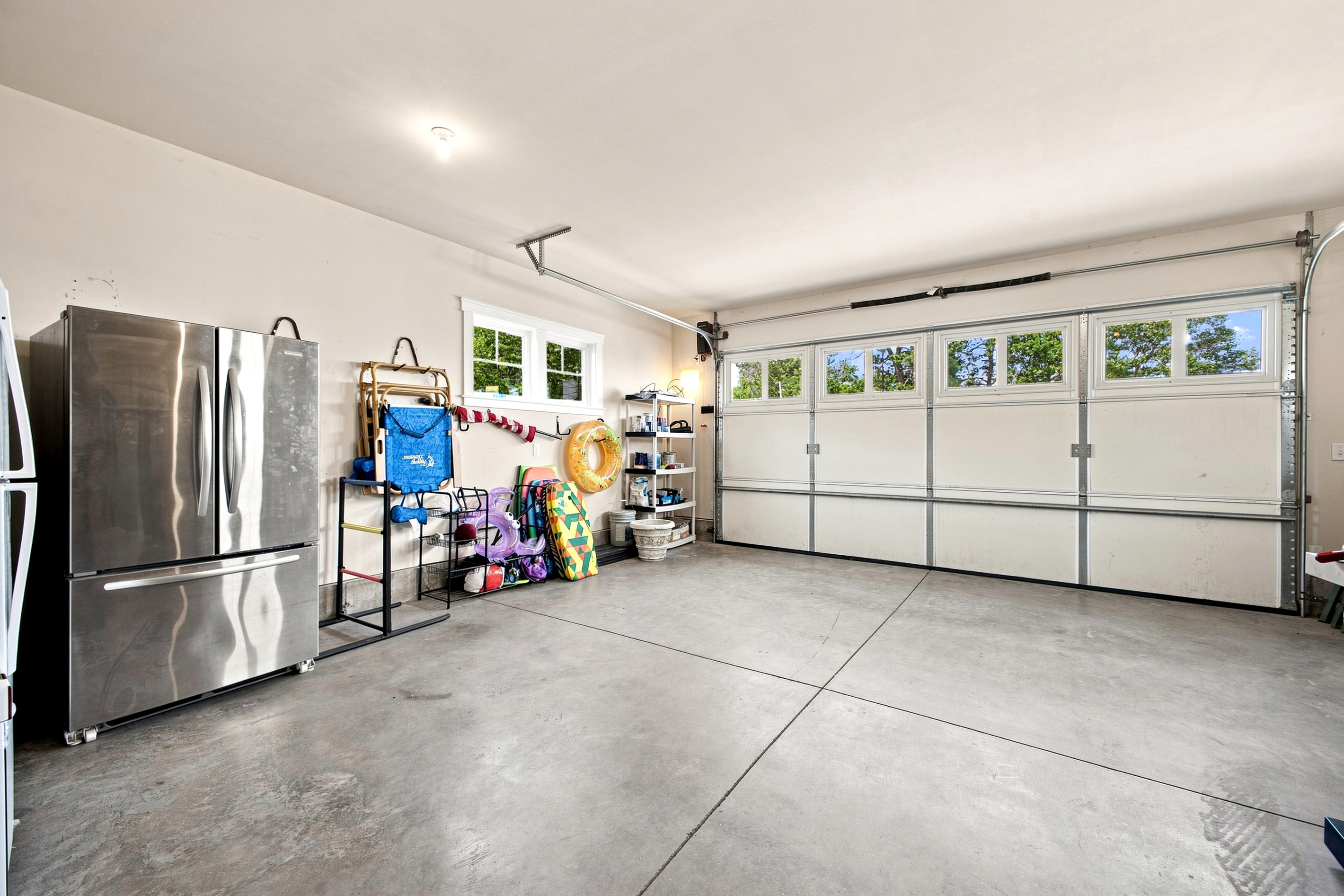 A spacious garage provides convenient covered space with easy access to the home.