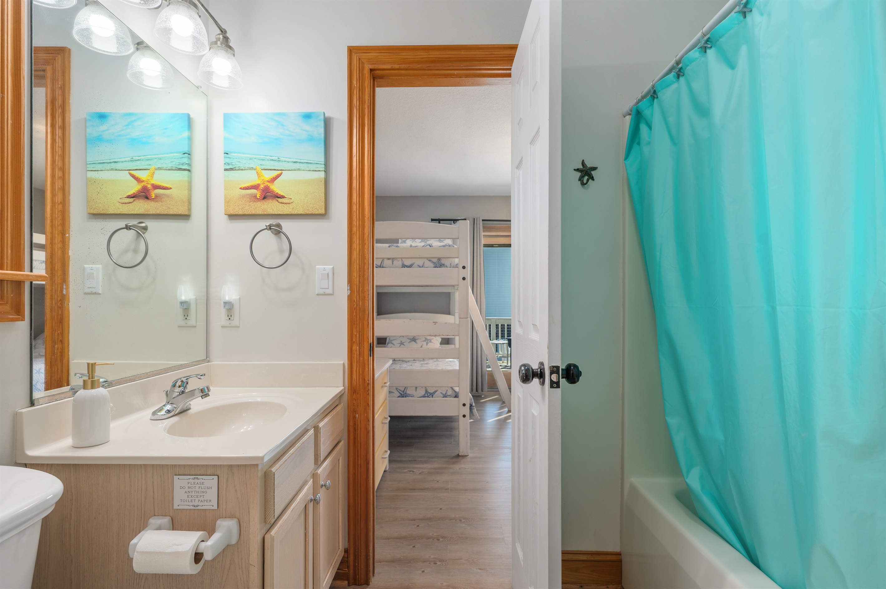 This bathroom is shared by the 2 bunk rooms. The bathtub is perfect for the little ones :)