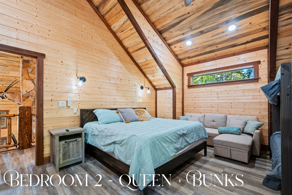 Stylish bedroom with cozy bedding and natural light.