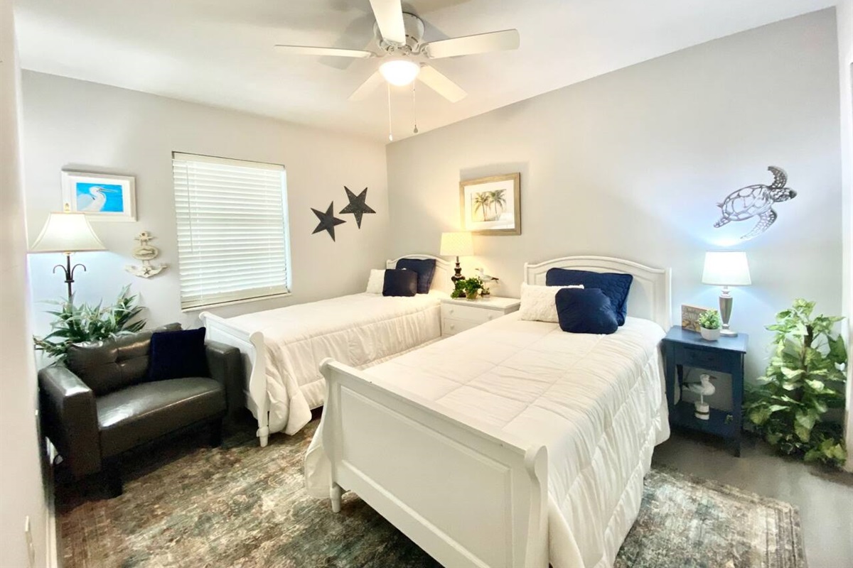 Bedroom #3 is cheerful and features two comfortable twin beds.