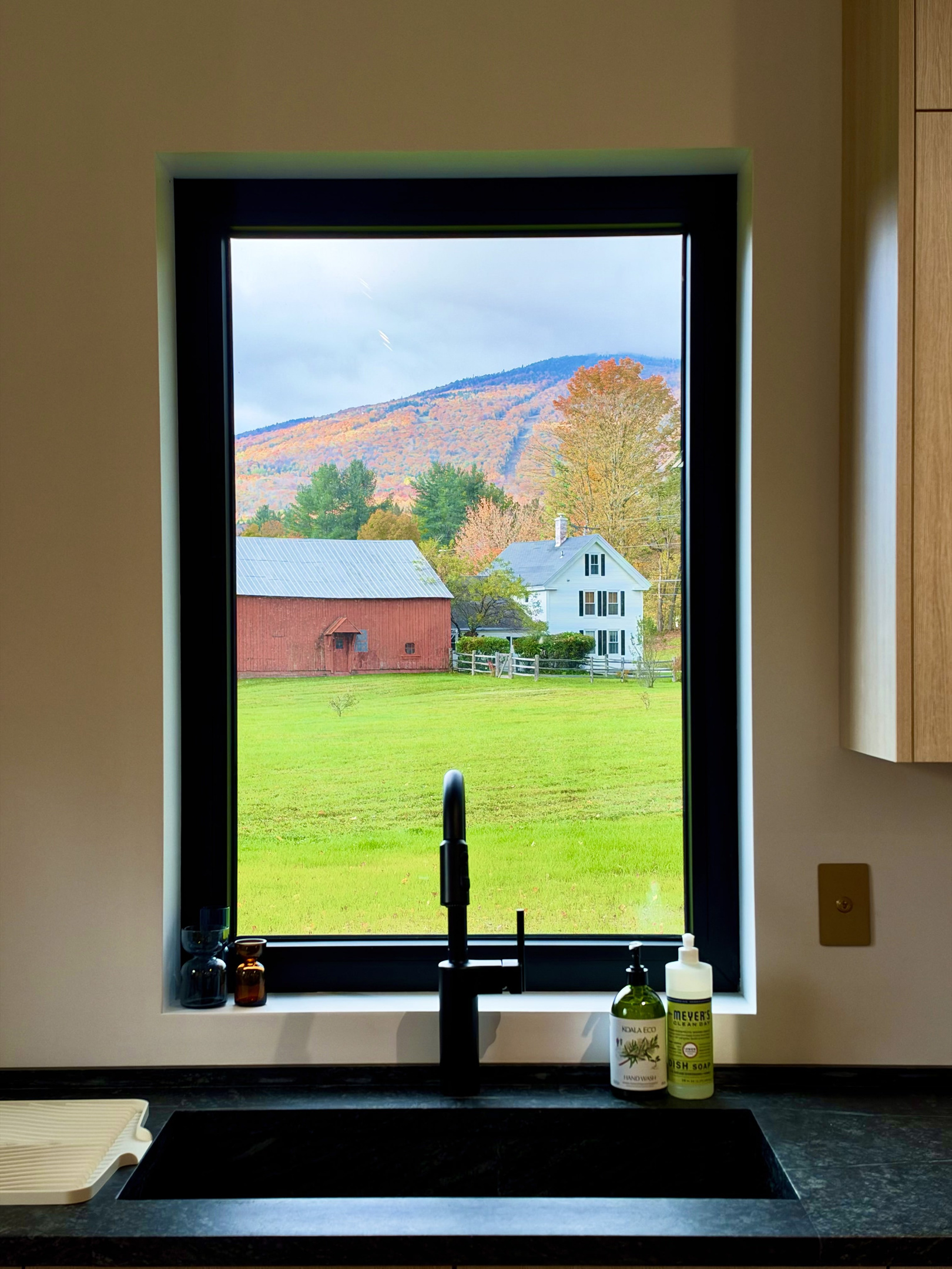 Custom soapstone countertops are complimented by views and all the accessories you could need.